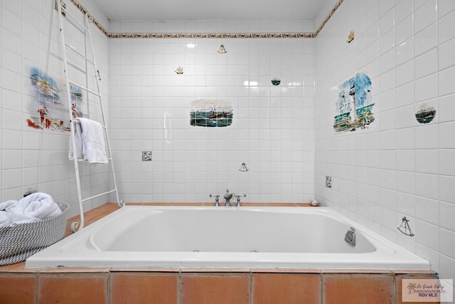 131 Windward Dr, Port Isabel, TX 78578 - bathroom with tile walls and a garden tub