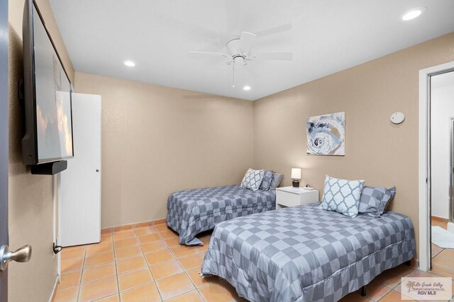 131 Windward Dr, Port Isabel, TX 78578 - bedroom with light tile patterned flooring, a ceiling fan, and recessed lighting