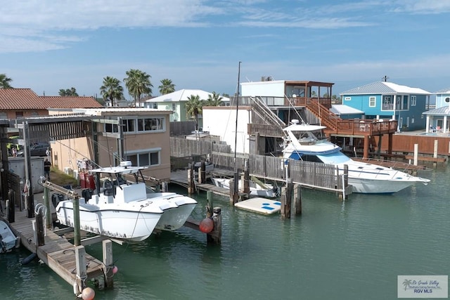 131 Windward Dr, Port Isabel, TX 78578 - dock area featuring a water view, boat lift, and a residential view