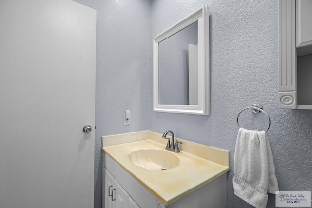 131 Windward Dr, Port Isabel, TX 78578 - bathroom with vanity and a textured wall