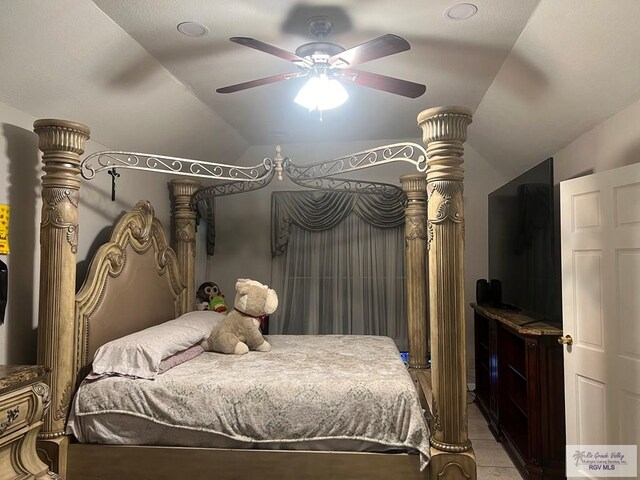 bedroom with ceiling fan and vaulted ceiling