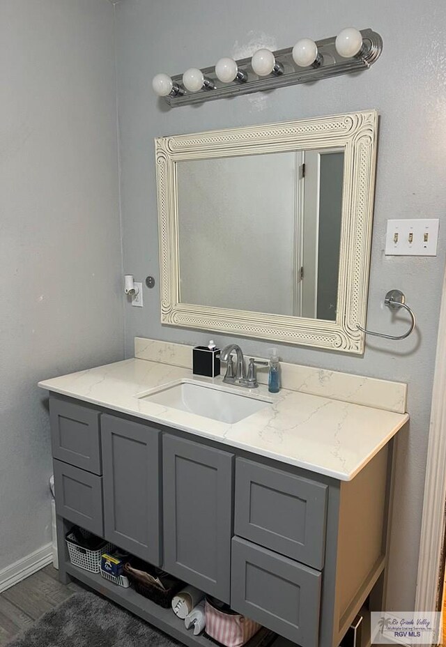 bathroom featuring hardwood / wood-style floors and vanity