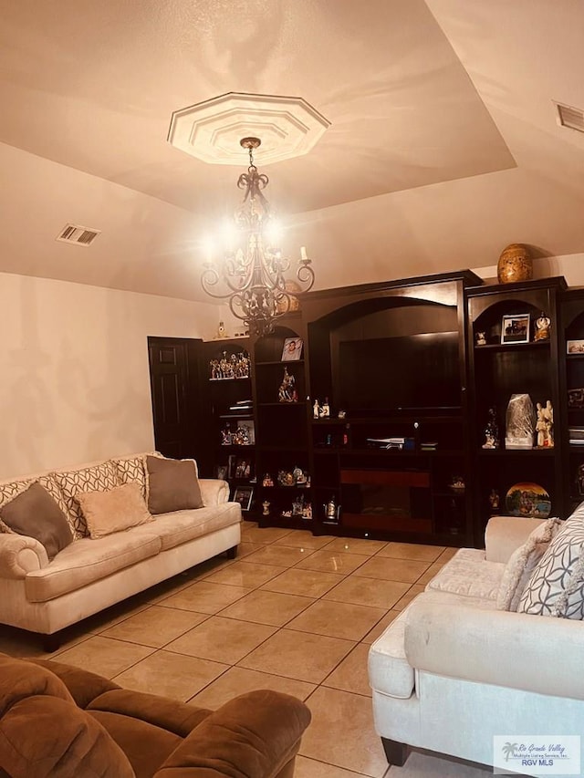 tiled living room featuring vaulted ceiling and a notable chandelier