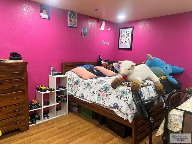 bedroom featuring light wood-type flooring