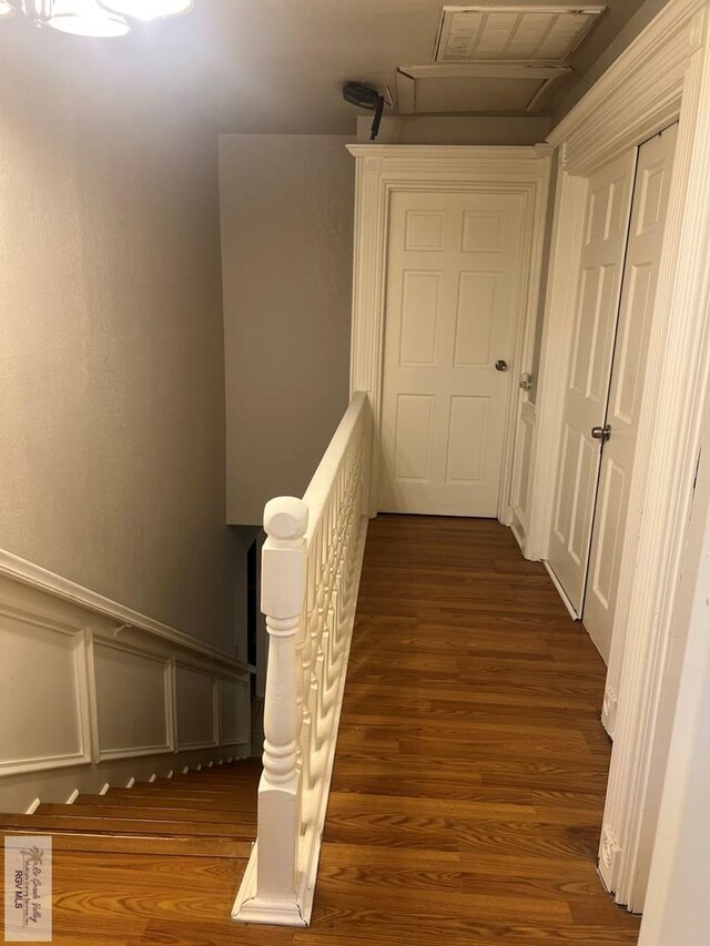 corridor featuring dark wood-type flooring