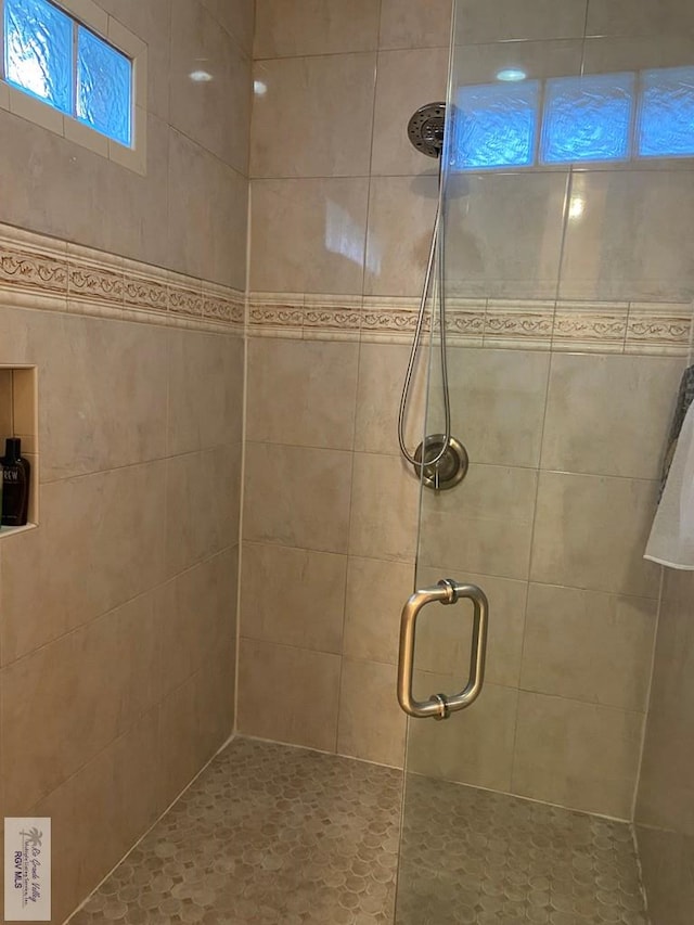 bathroom featuring an enclosed shower