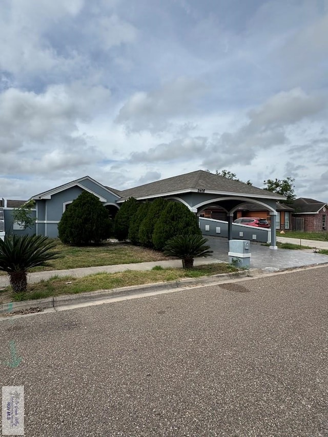 view of front of home featuring a garage and concrete driveway