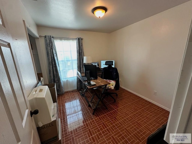 office area featuring dark tile patterned floors