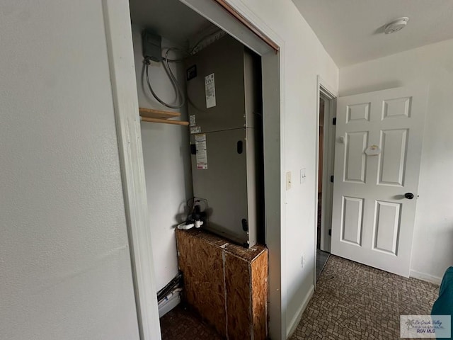 hallway featuring heating unit