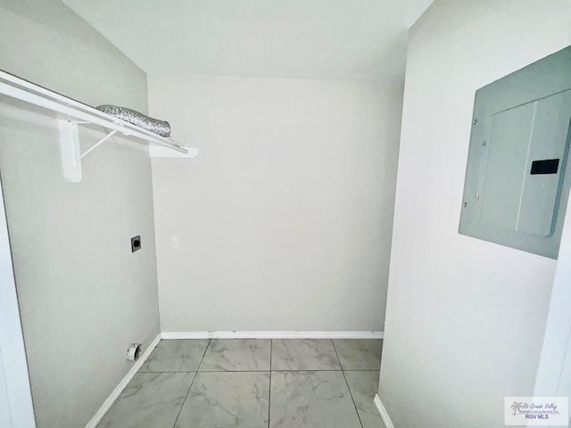 43 El Paso Rd, Brownsville, TX 78520 - laundry area with electric panel, laundry area, hookup for an electric dryer, and baseboards