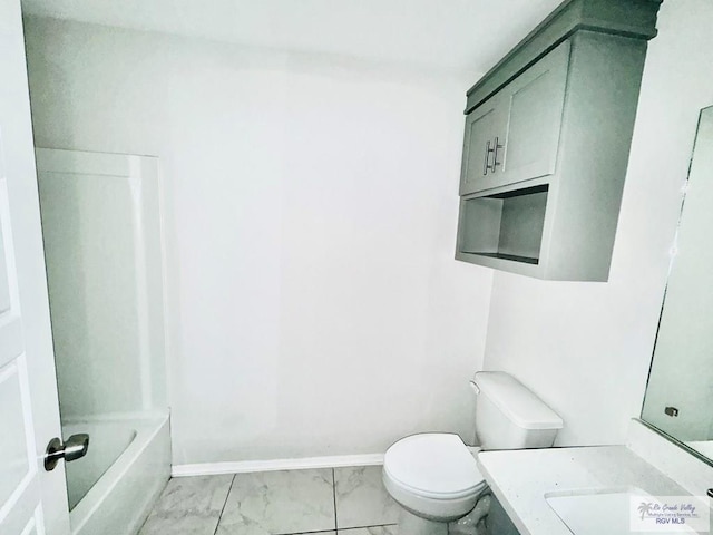 43 El Paso Rd, Brownsville, TX 78520 - bathroom with baseboards, toilet, marble finish floor, and vanity