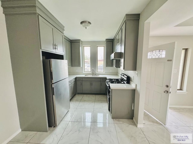 43 El Paso Rd, Brownsville, TX 78520 - kitchen with gray cabinets, marble finish floor, appliances with stainless steel finishes, and a sink