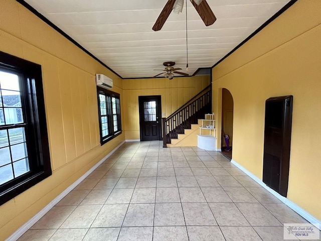 foyer featuring ornamental molding, an AC wall unit, and ceiling fan