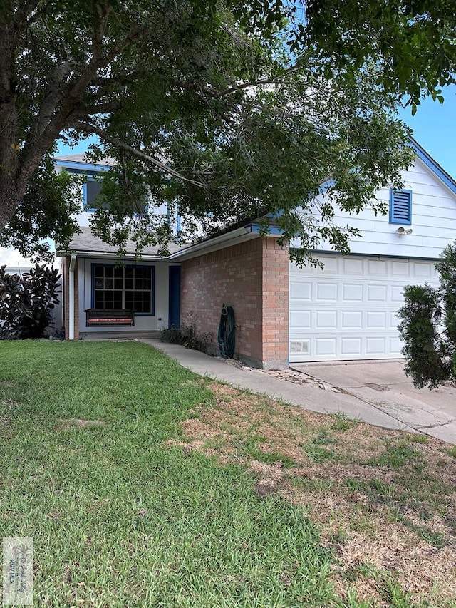 single story home with a front yard and a garage