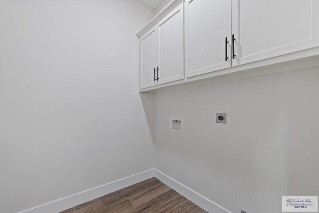 25219 Chelsea Ln, Harlingen, TX 78552 - laundry area featuring cabinet space, hookup for an electric dryer, dark wood-style flooring, baseboards, and washer hookup