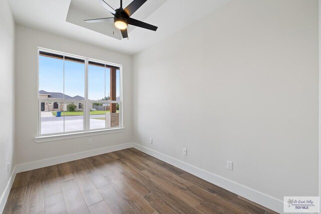 25219 Chelsea Ln, Harlingen, TX 78552 - spare room featuring baseboards, dark wood-style flooring, and a ceiling fan