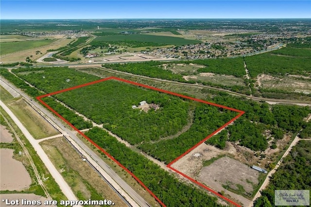 birds eye view of property featuring a rural view