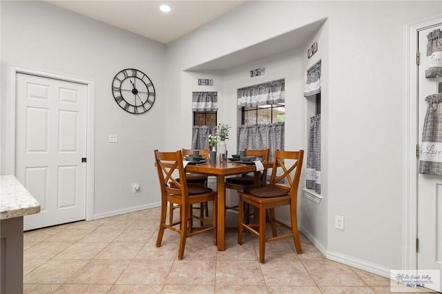 dining space with light tile patterned floors