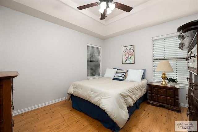 bedroom featuring light hardwood / wood-style floors and ceiling fan