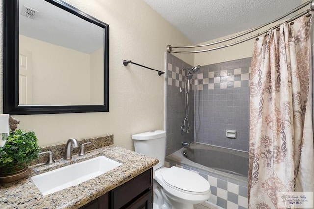 5 Mantua St, Brownsville, TX 78526 - bathroom featuring shower / bath combination with curtain, vanity, and a textured ceiling