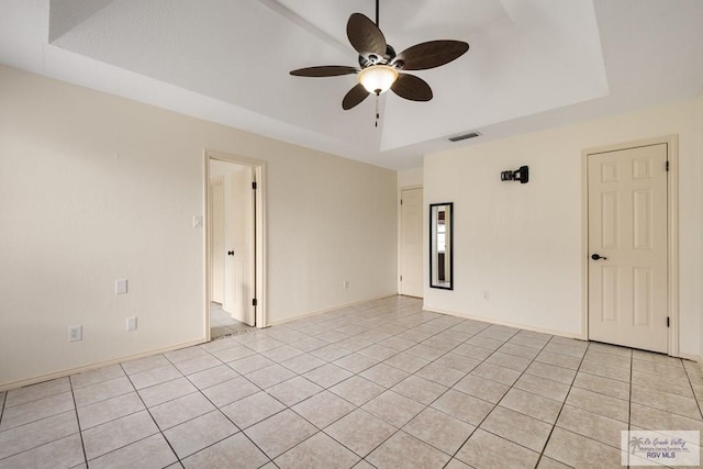 5 Mantua St, Brownsville, TX 78526 - empty room with a raised ceiling, a ceiling fan, and light tile patterned floors