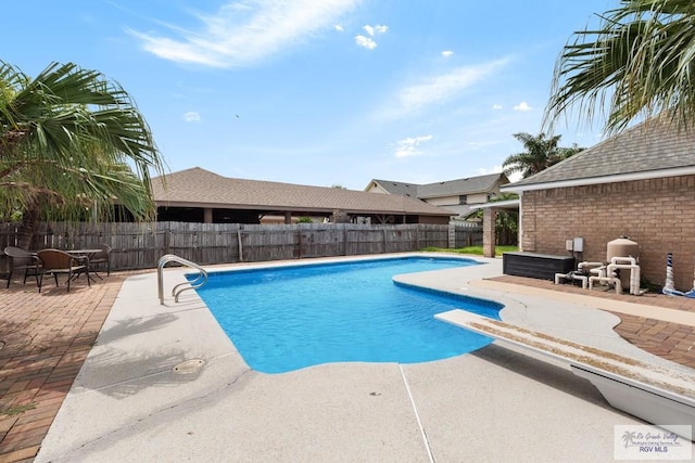 5 Mantua St, Brownsville, TX 78526 - view of swimming pool with a patio, a fenced backyard, and a diving board
