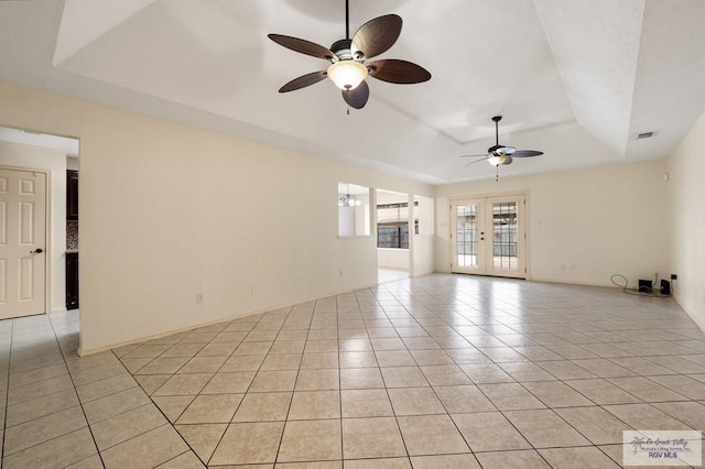 5 Mantua St, Brownsville, TX 78526 - unfurnished room with a tray ceiling, a ceiling fan, and light tile patterned flooring