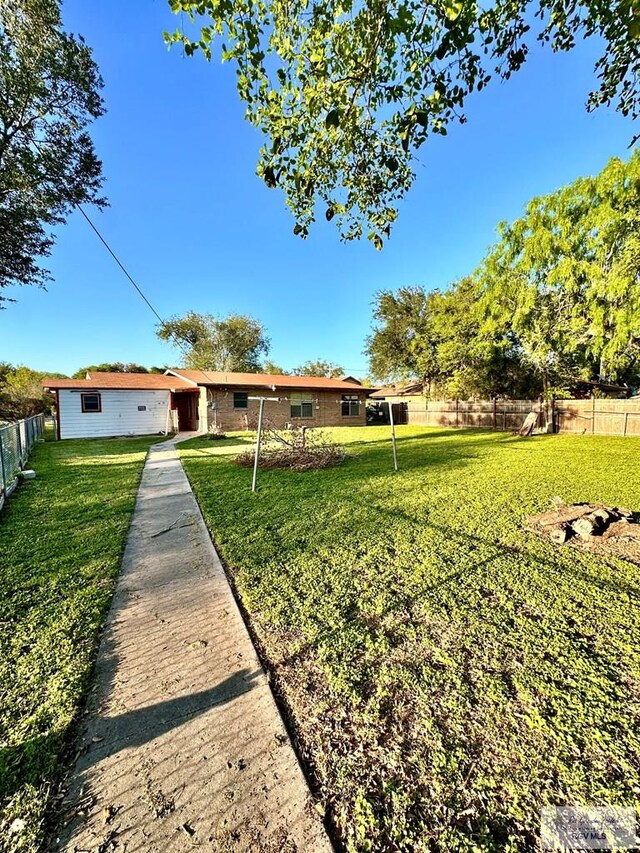 697 W White Ave, Raymondville, TX 78580 - view of yard with fence