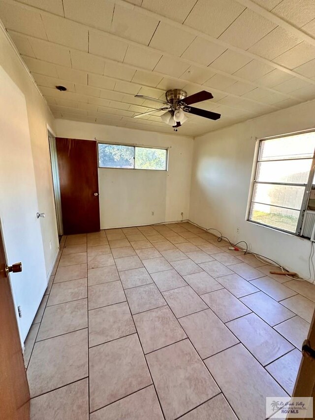 697 W White Ave, Raymondville, TX 78580 - spare room featuring light tile patterned floors and ceiling fan