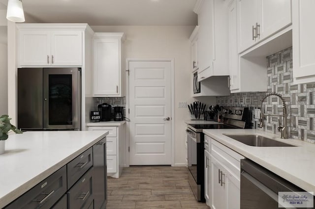 3214 W Hapner St, Harlingen, TX 78550 - kitchen featuring dishwasher, electric range, white cabinets, and light countertops