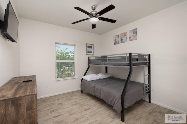 3214 W Hapner St, Harlingen, TX 78550 - bedroom with light wood-style flooring and a ceiling fan