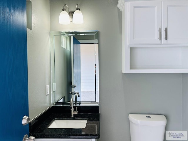 bathroom featuring toilet and sink