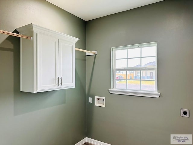 laundry room with hookup for an electric dryer, cabinets, and washer hookup