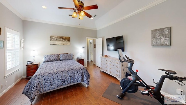 bedroom featuring wood-type flooring, ceiling fan, and ornamental molding