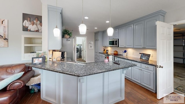 kitchen featuring gray cabinetry, hardwood / wood-style floors, and appliances with stainless steel finishes