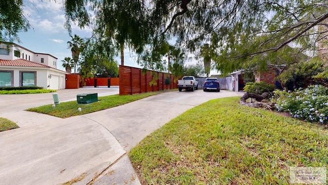 view of side of property with a lawn