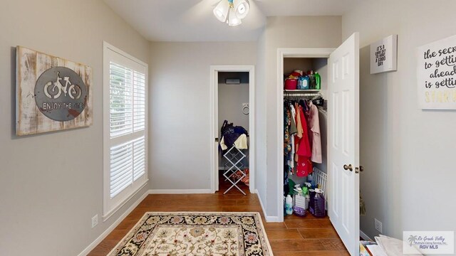 corridor featuring hardwood / wood-style flooring