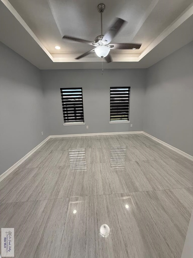 3585 Westcreek Dr, Brownsville, TX 78526 - empty room with a raised ceiling, a ceiling fan, and recessed lighting