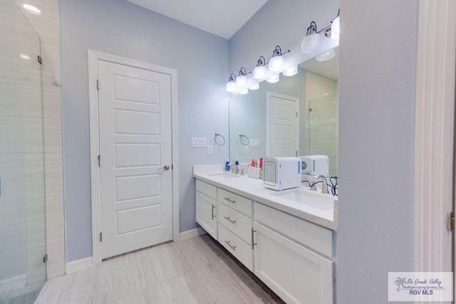 3585 Westcreek Dr, Brownsville, TX 78526 - bathroom featuring a stall shower and double vanity