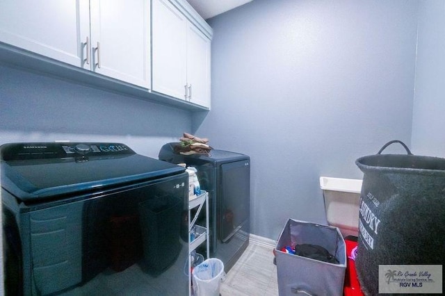 3585 Westcreek Dr, Brownsville, TX 78526 - laundry room featuring cabinet space and washer and dryer