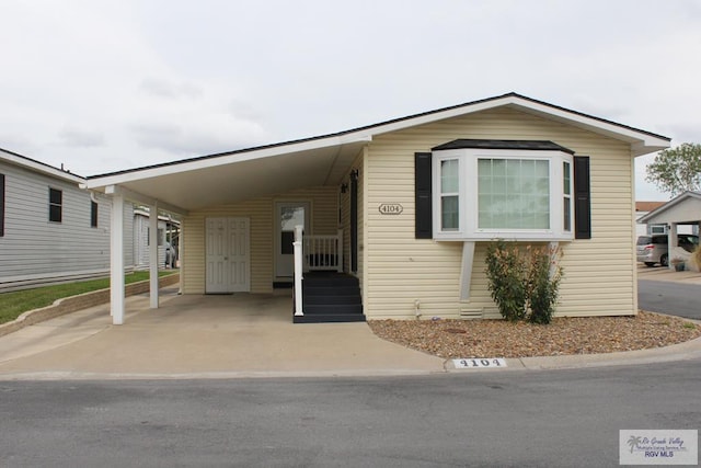 view of front of home featuring a carport