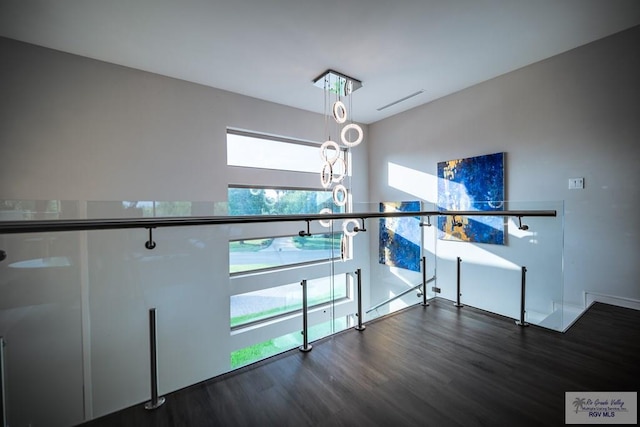 interior space featuring a healthy amount of sunlight and dark hardwood / wood-style floors
