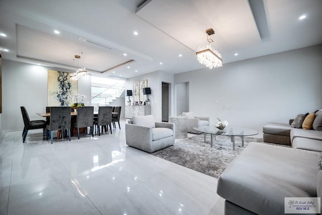 living room featuring a notable chandelier
