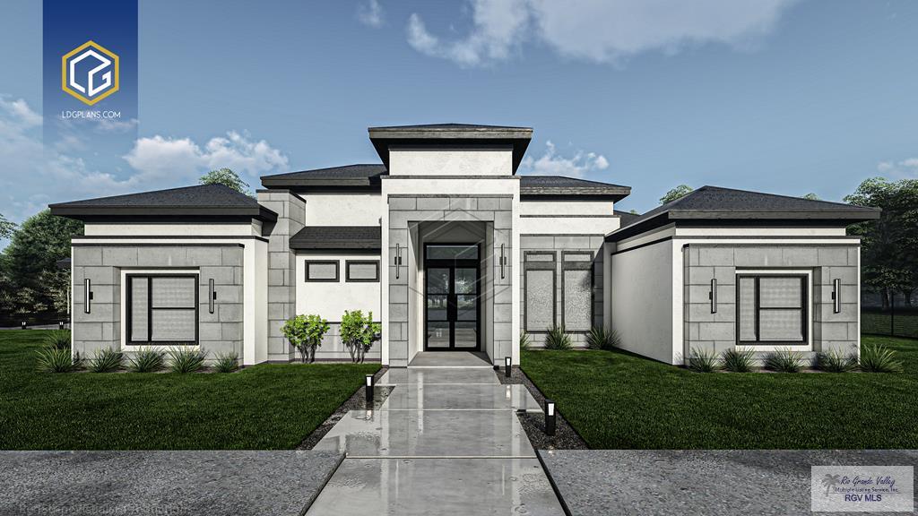 view of front facade with a front yard and stucco siding