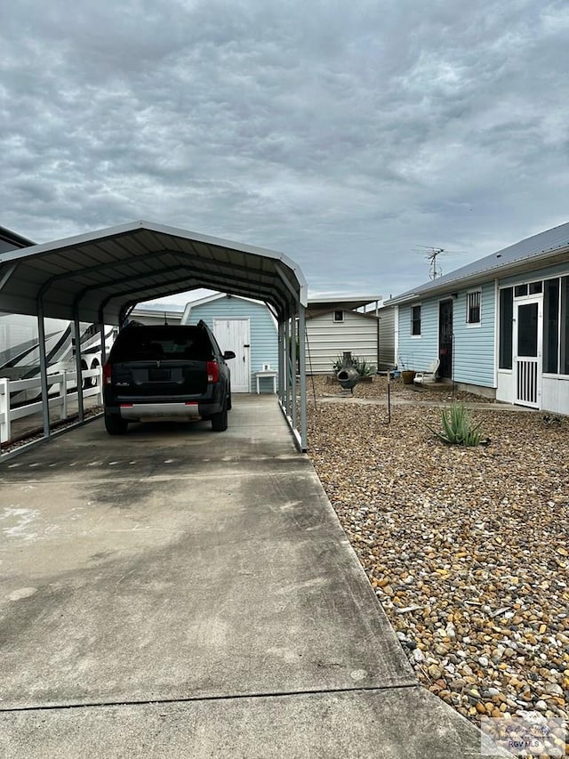 view of vehicle parking with a carport