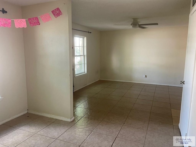 2402 Ed Carey Dr Unit 33, Harlingen, TX 78550 - unfurnished room with light tile patterned floors and a ceiling fan