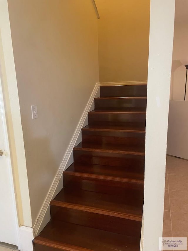 2402 Ed Carey Dr Unit 33, Harlingen, TX 78550 - staircase with tile patterned floors