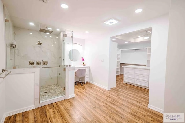 bathroom featuring walk in shower and hardwood / wood-style floors