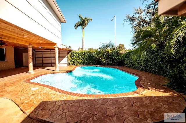 view of swimming pool featuring a patio area