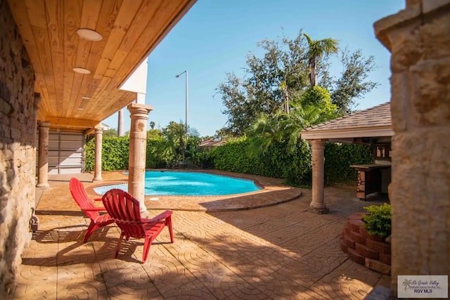 view of pool featuring a gazebo and a patio